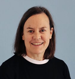 A woman smiling at the camera.