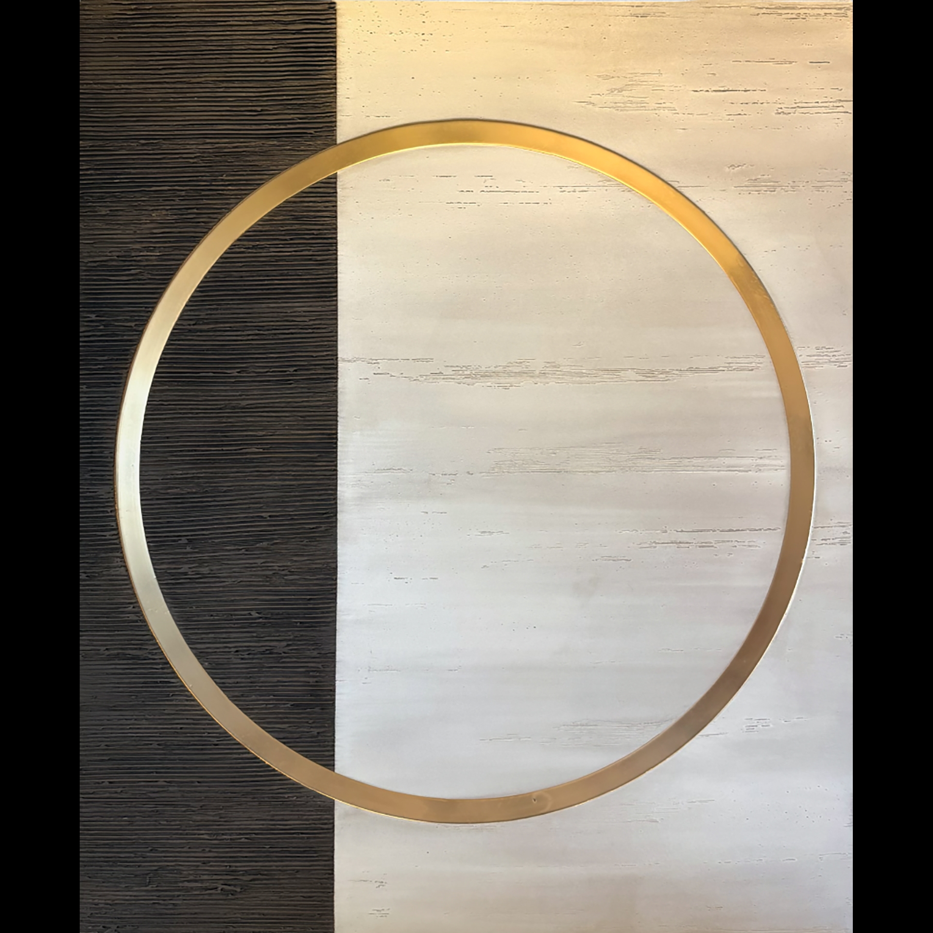 A gold circle against a black and white rectangle.