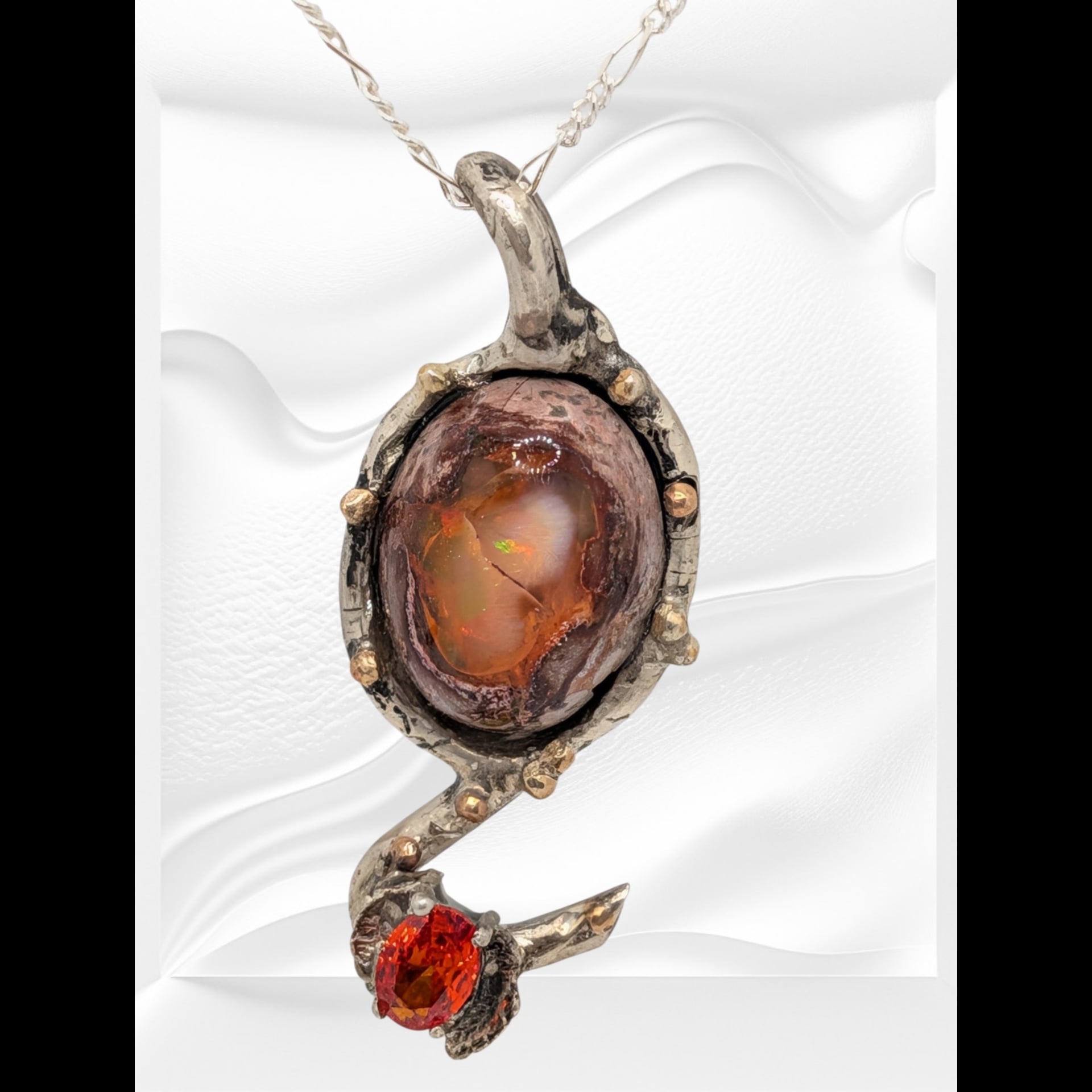 A large orange pendant with a hook at the bottom.