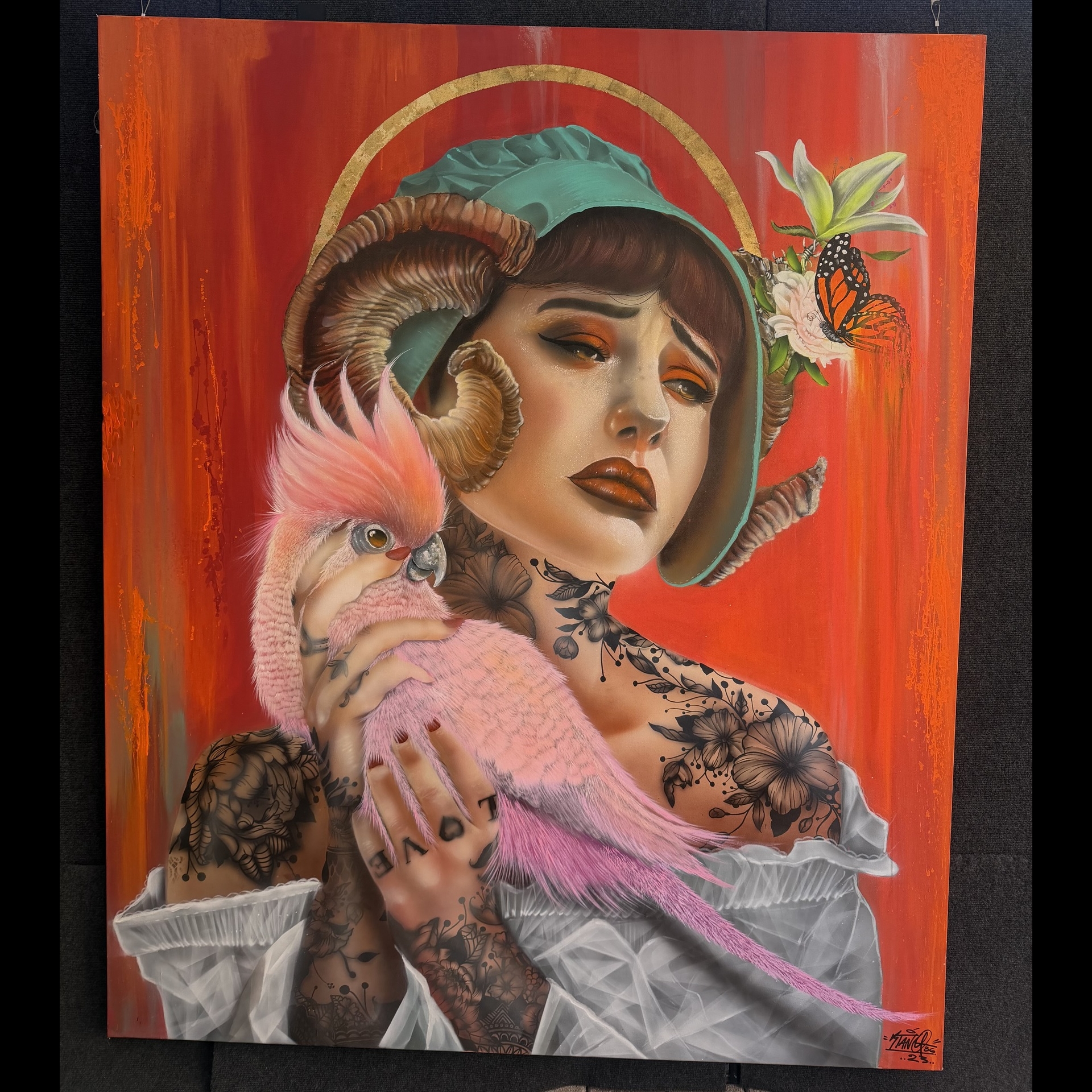 A painting of a woman with horns holding a bird.