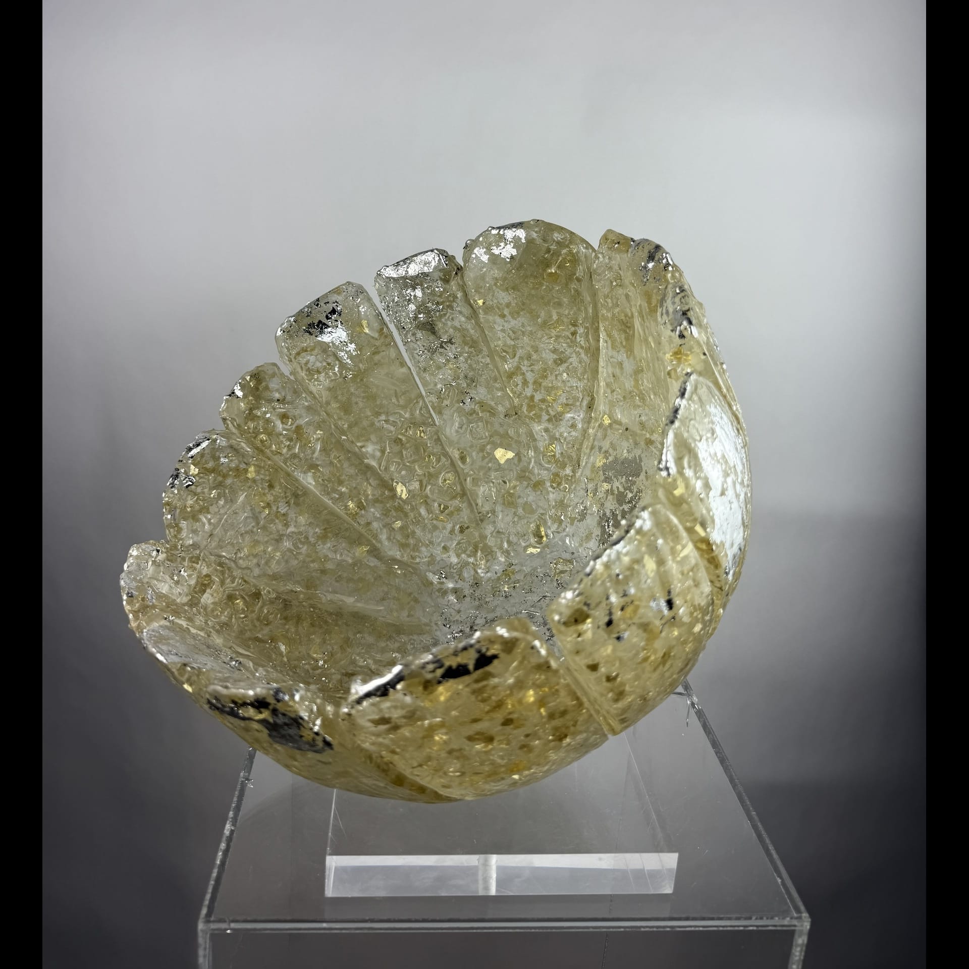 A semi transparent bowl on a pedestal.
