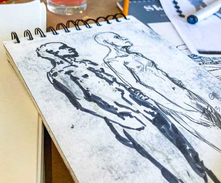 Drawings of a man on a table.