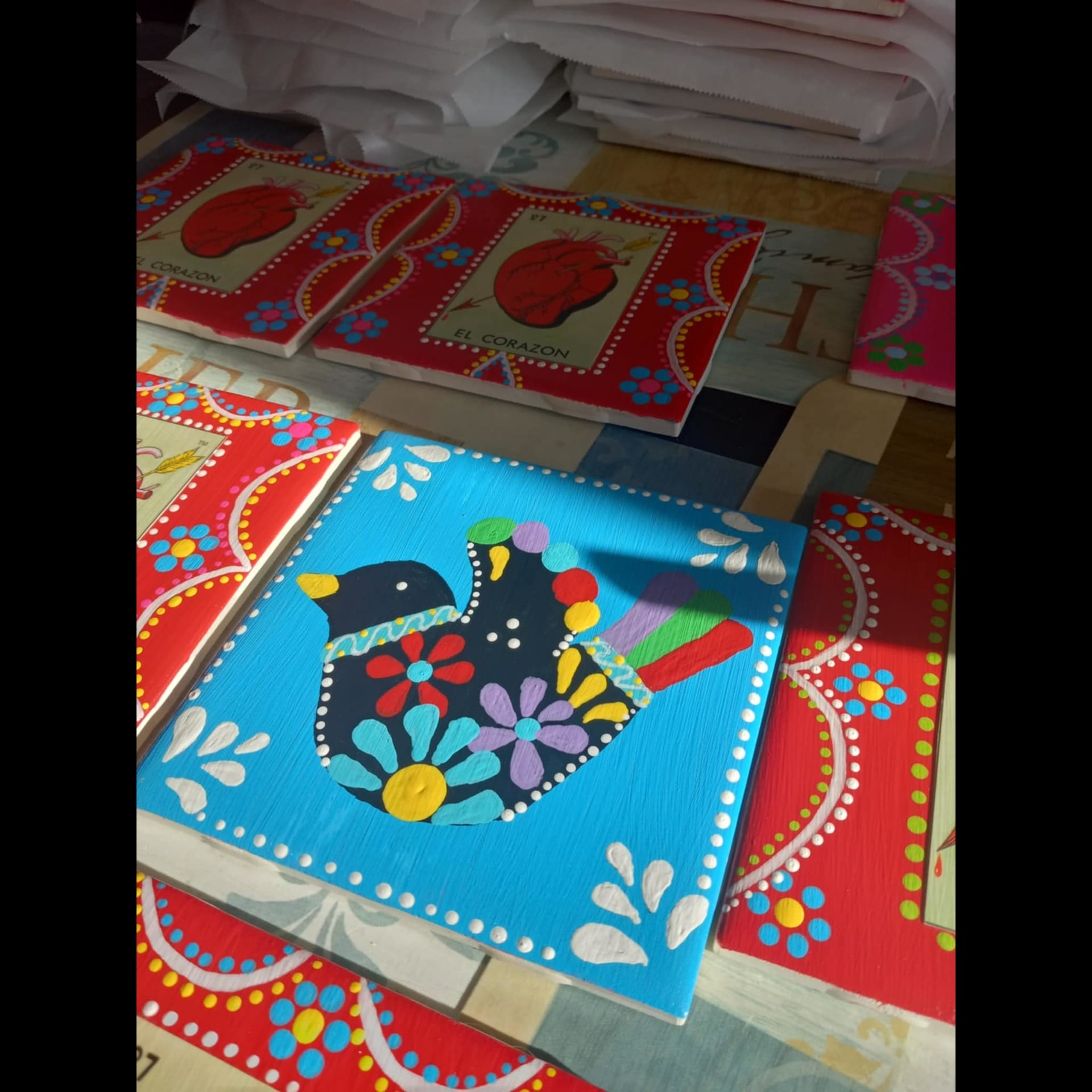 Various painted tiles withe dot patterns.
