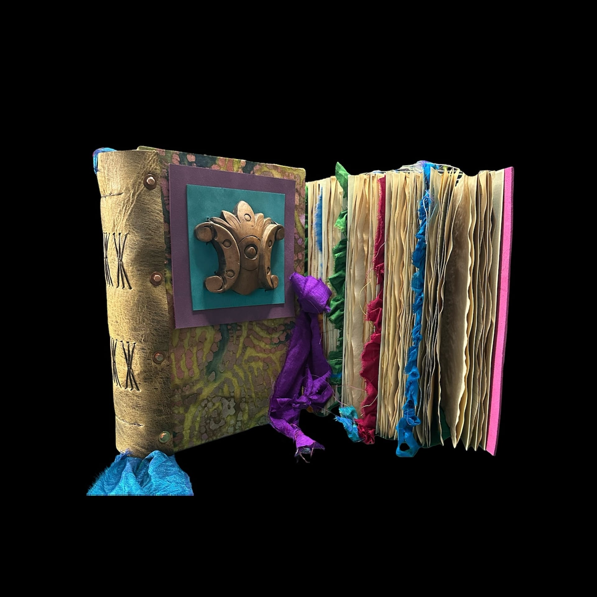 A decorative notebook with colorful ribbons.