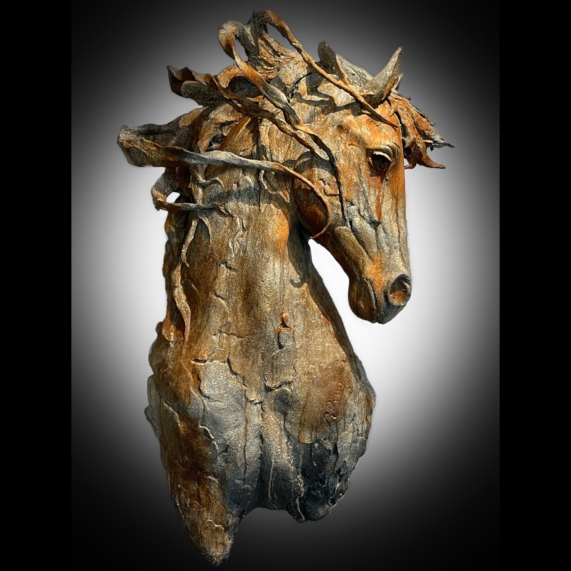 A wooden head of a horse.