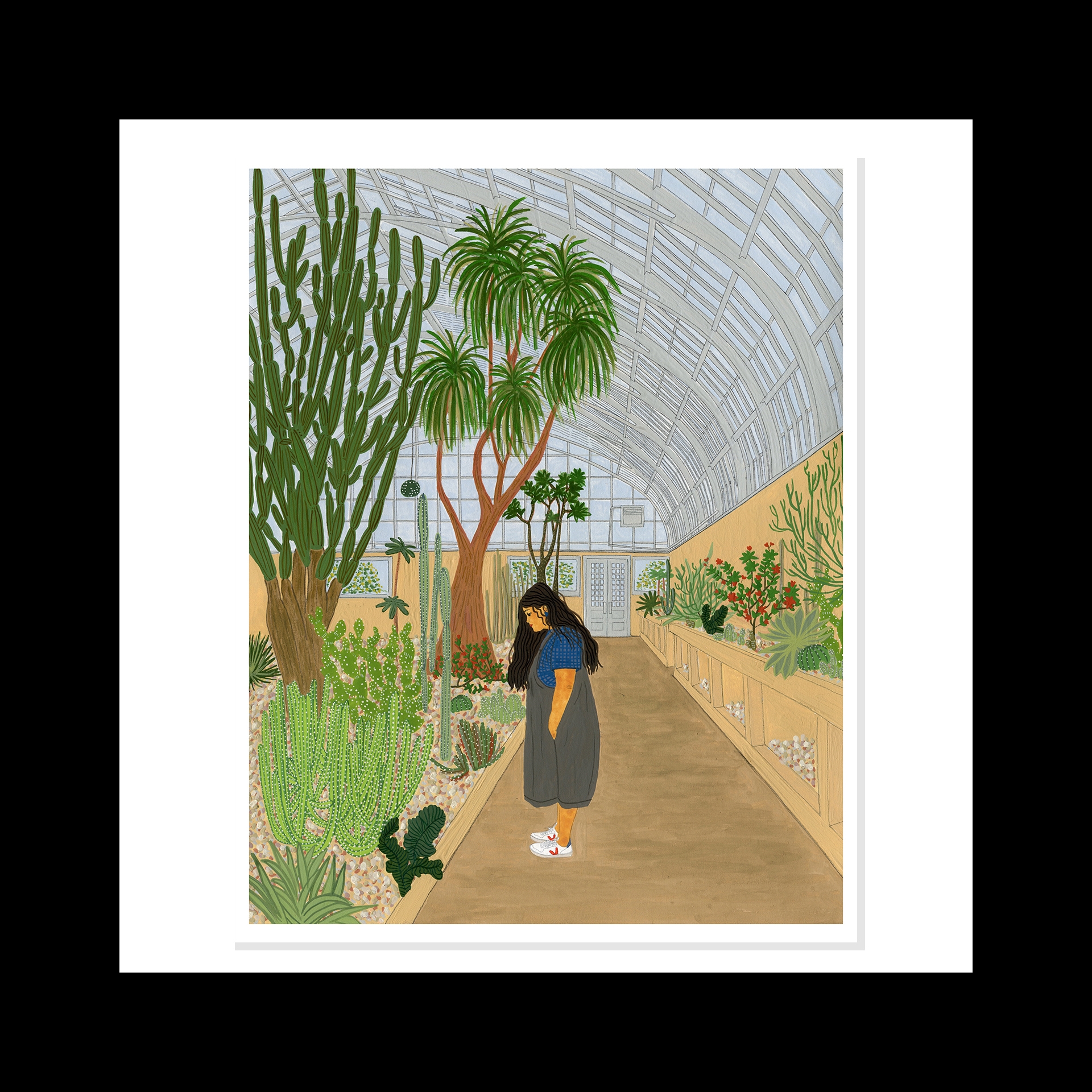 A woman looking at a cactus in a garden.