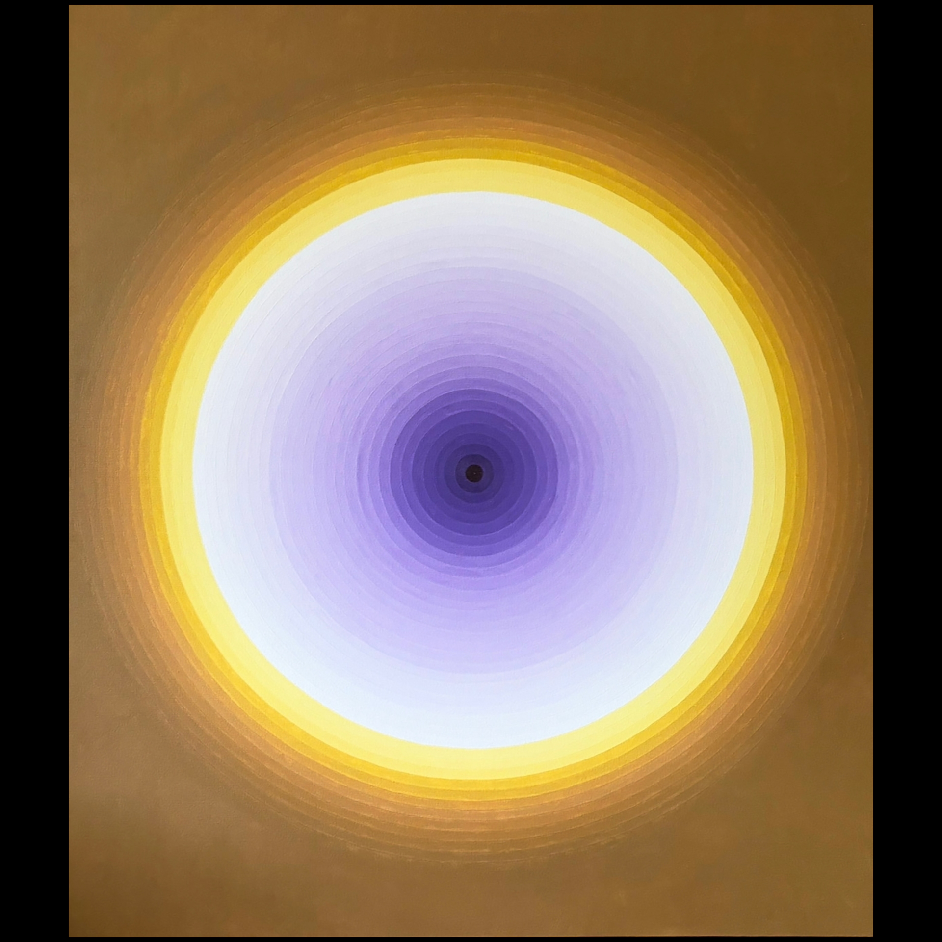 A bright circle with purple in the center.