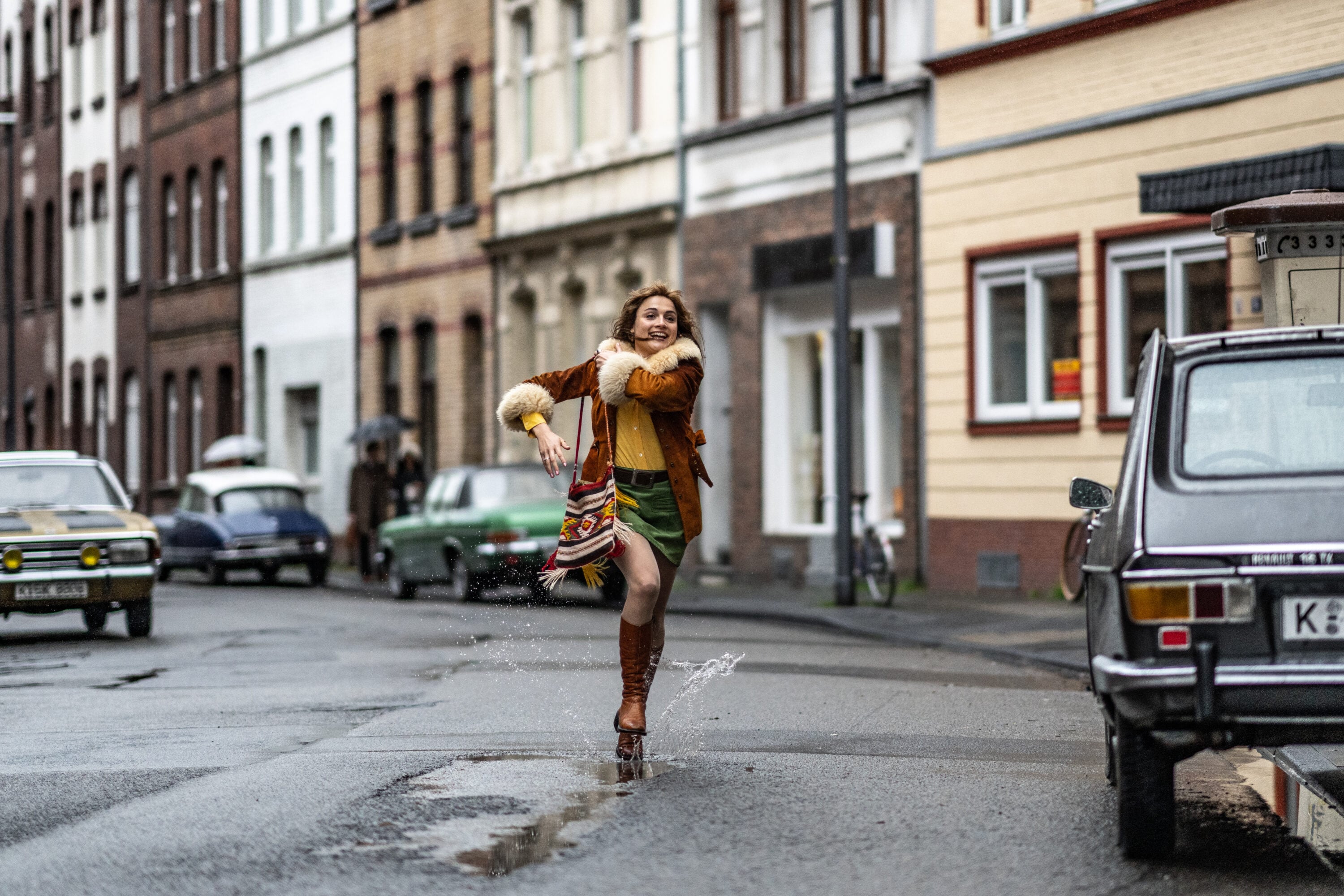 A woman running in a city street.