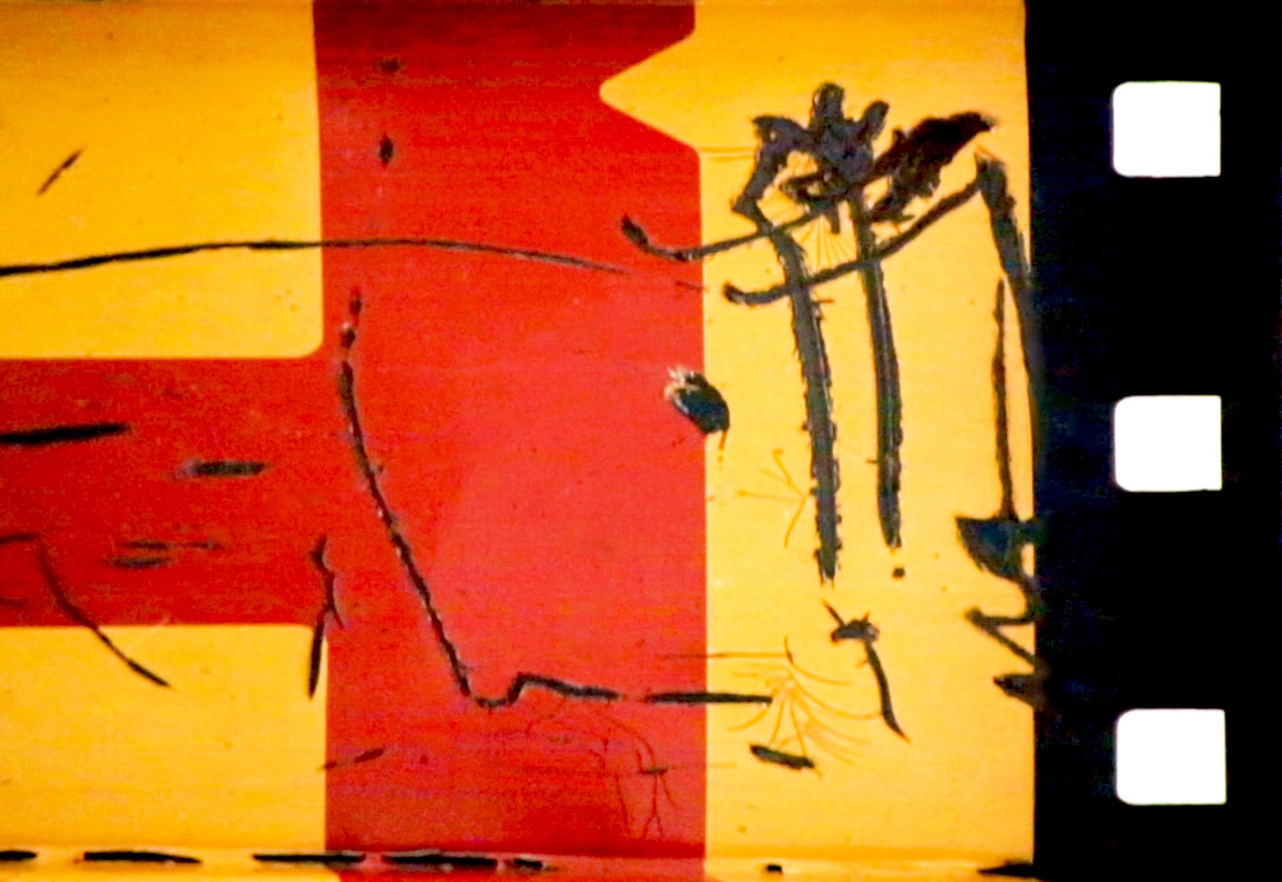 Film still showing a red and yellow area with black scratches and a black bar running down the right side.