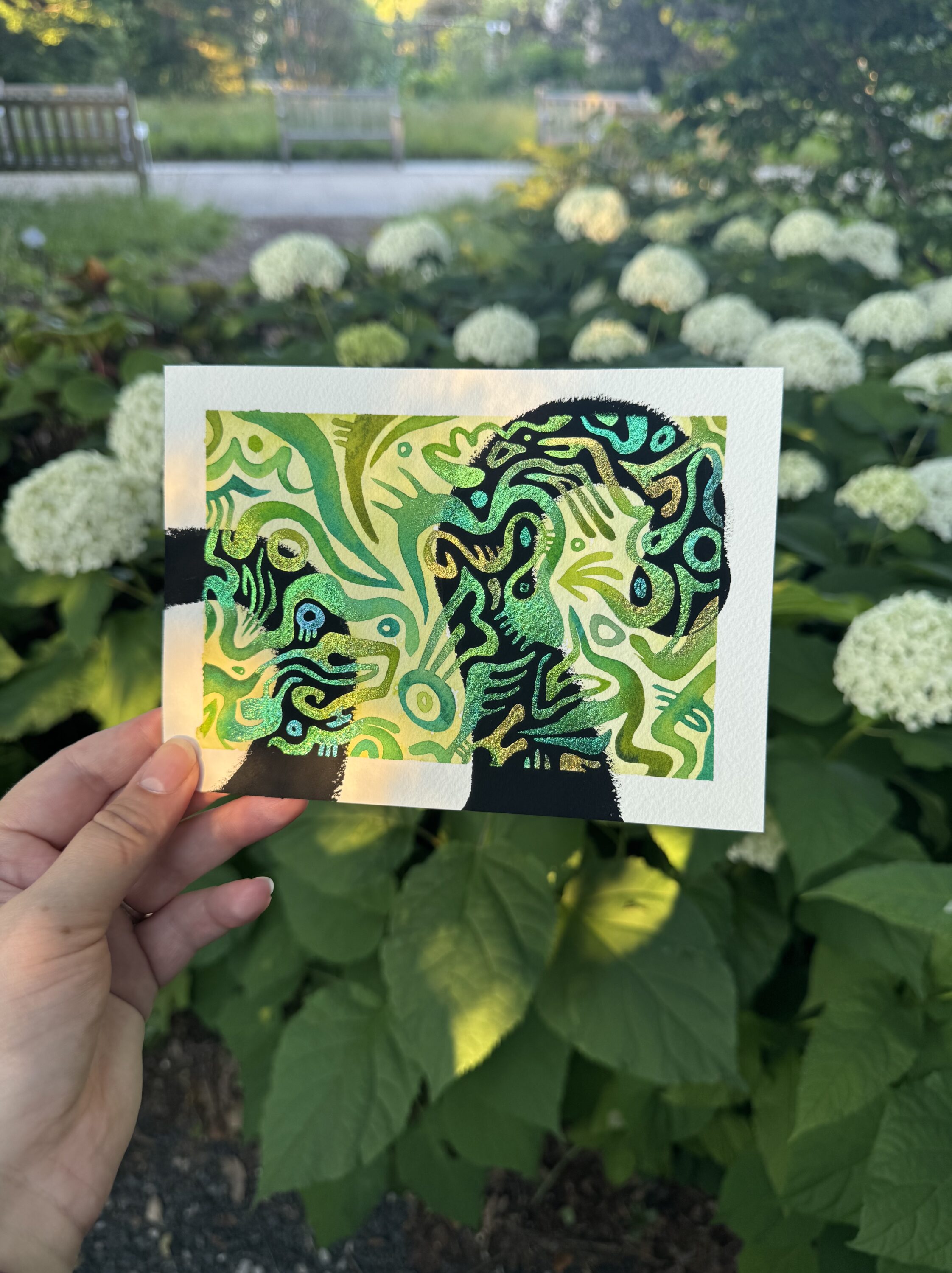 An art work with many greens and yellows.