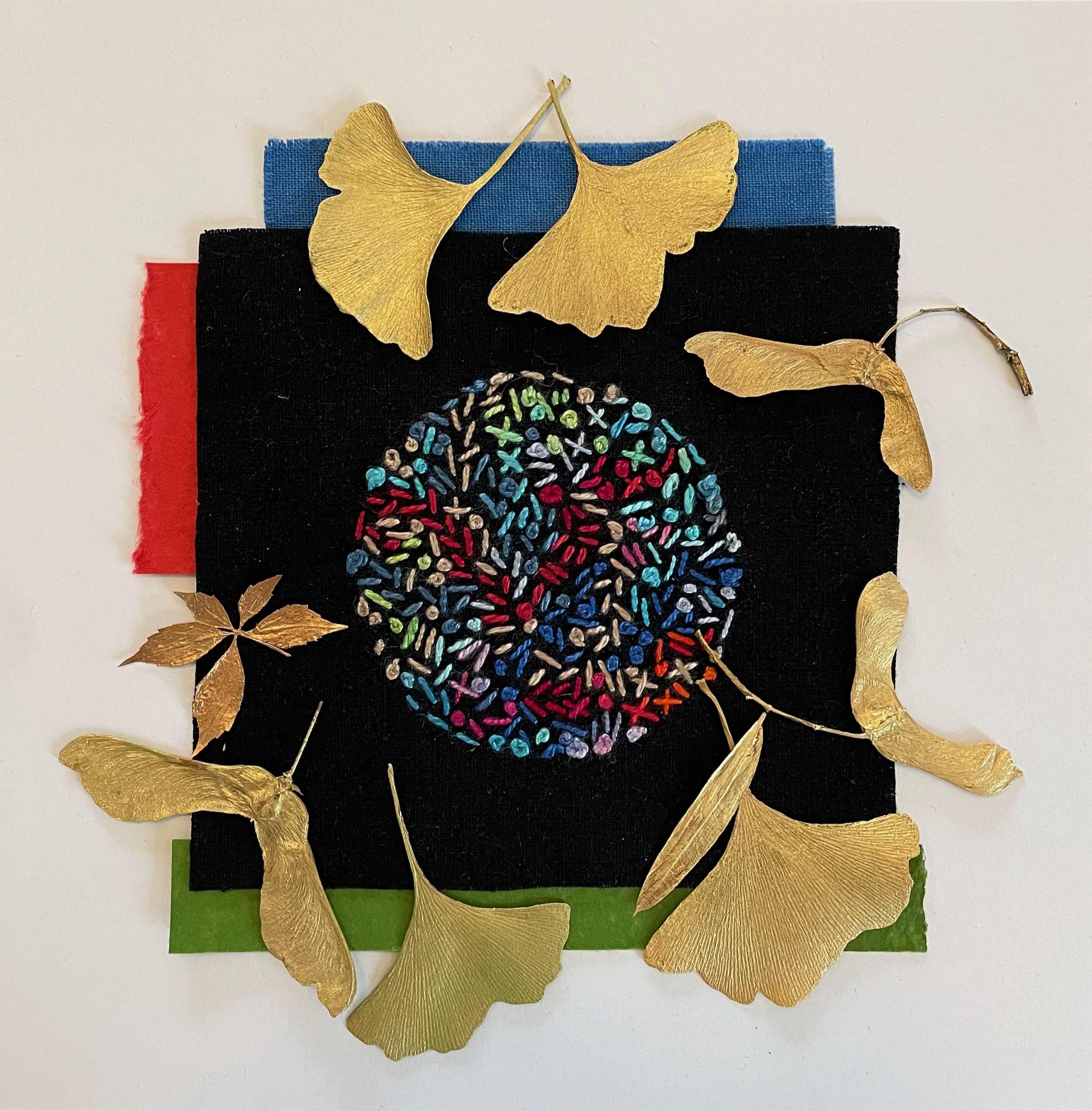 Leaves and fiber arts layered on top of one another.