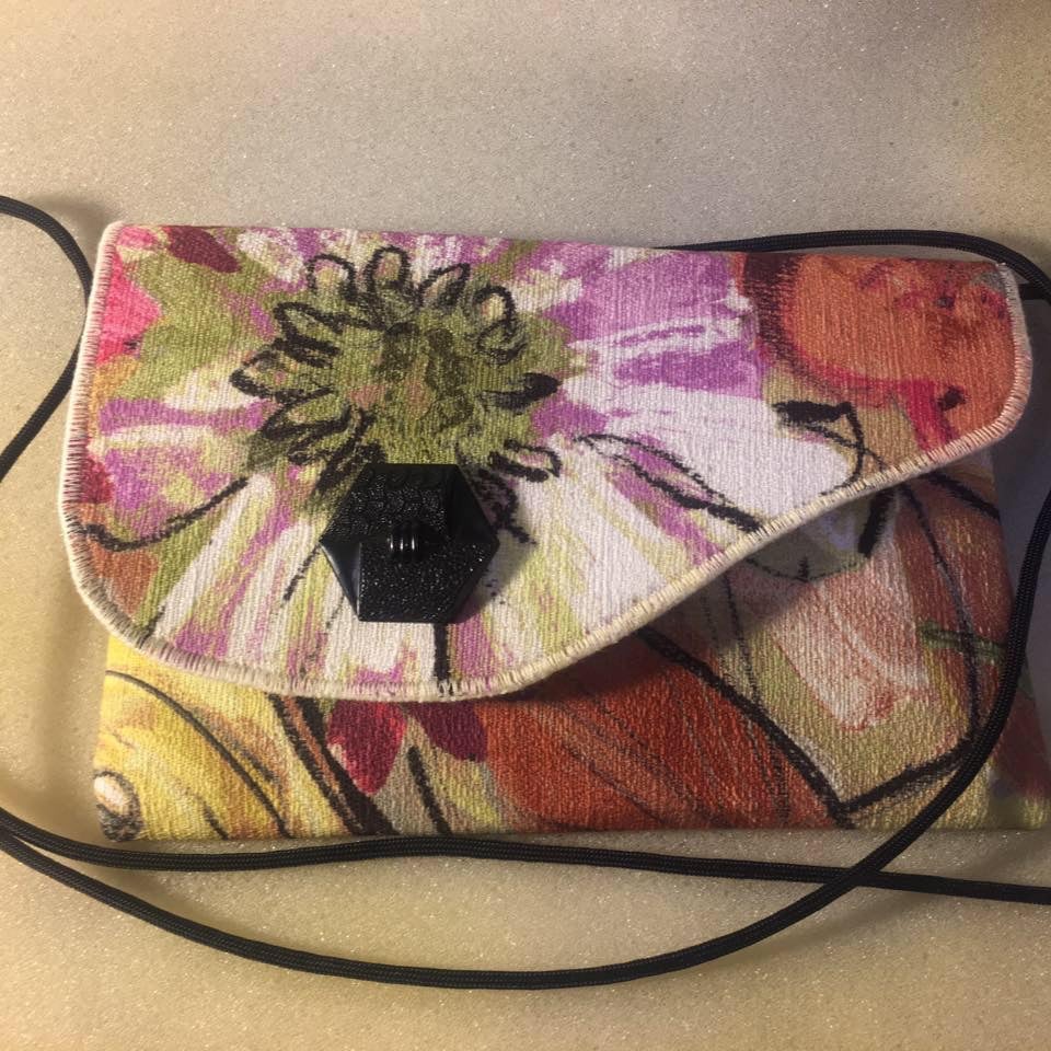 A colorful hand bag.