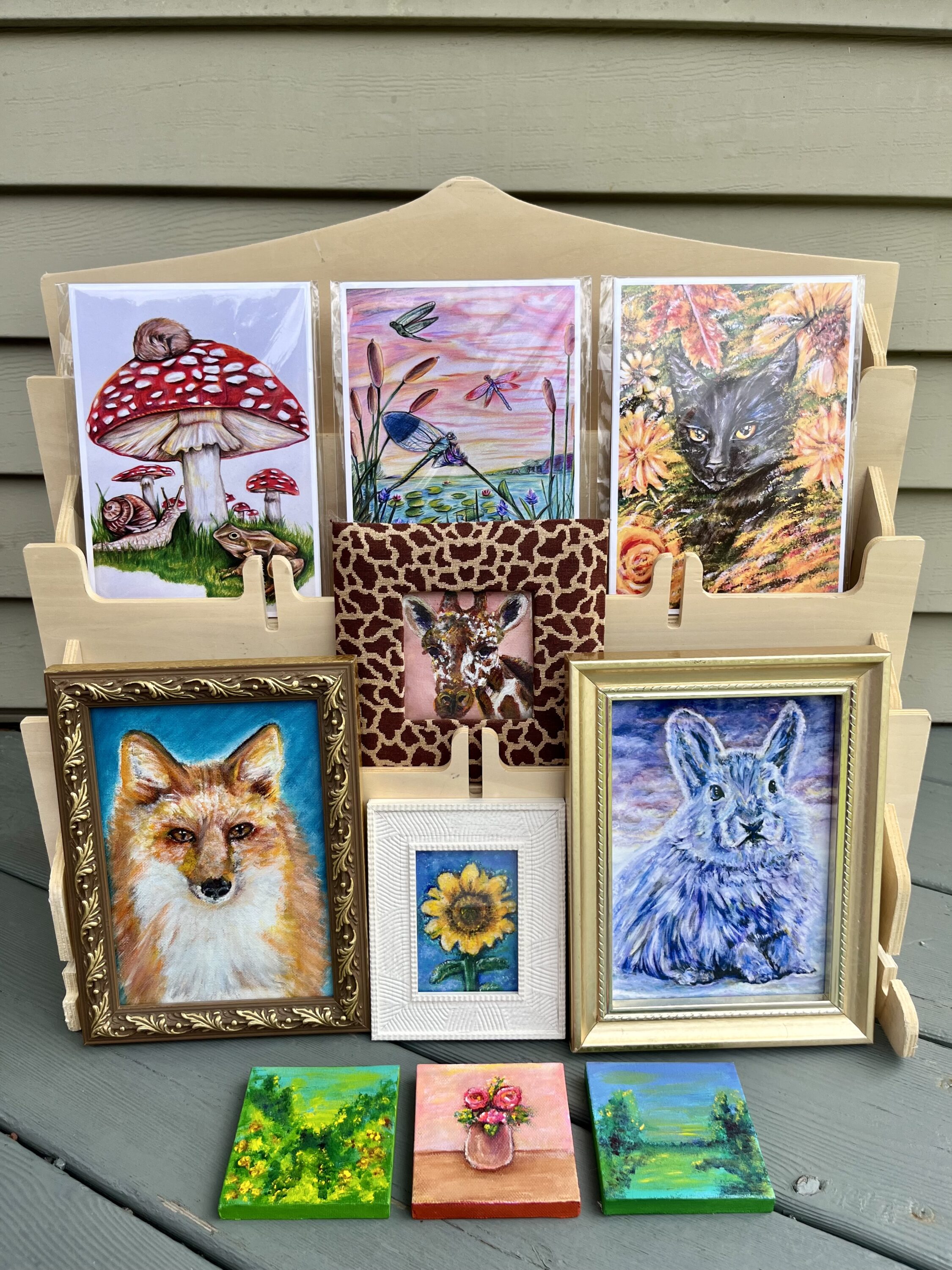Many small paintings of animals and nature.