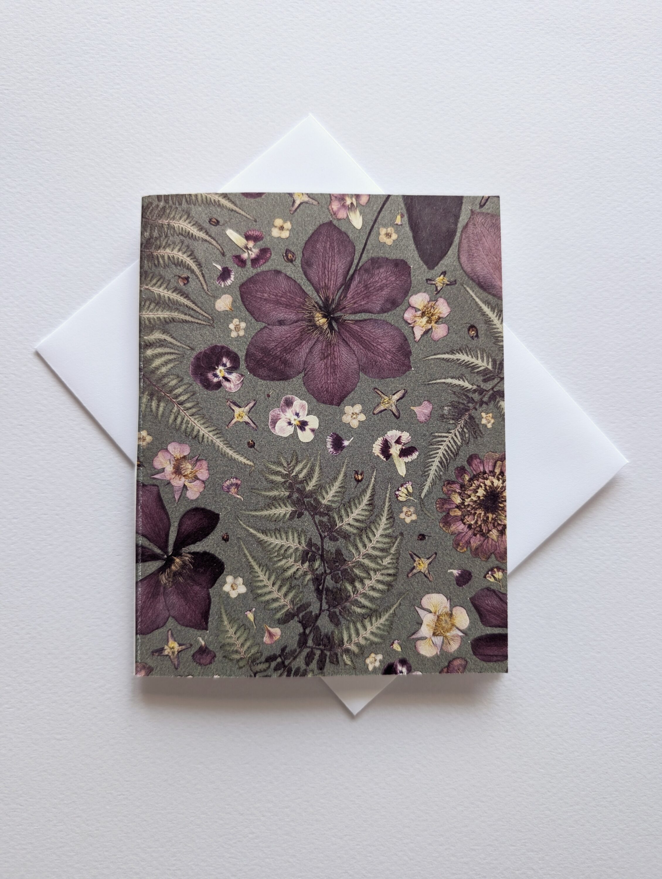 Pressed flowers on a card.